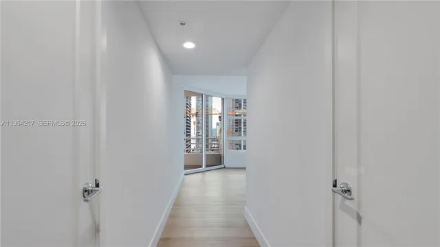 a view of an empty room with a window