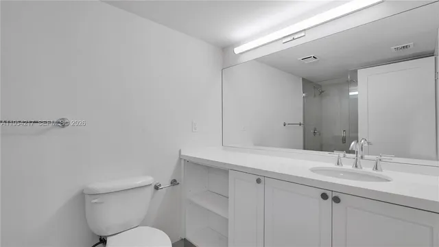a bathroom with a shower and a toilet