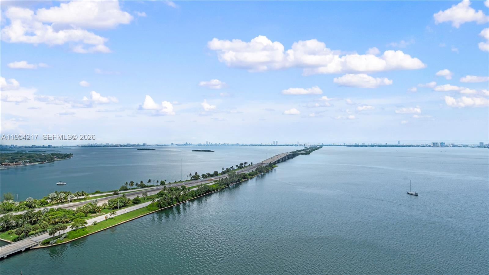 555 Northeast 34th Street, Unit 2201 Miami, FL 33137 - Photo 32 of 46 a view of a lake and mountain in the back