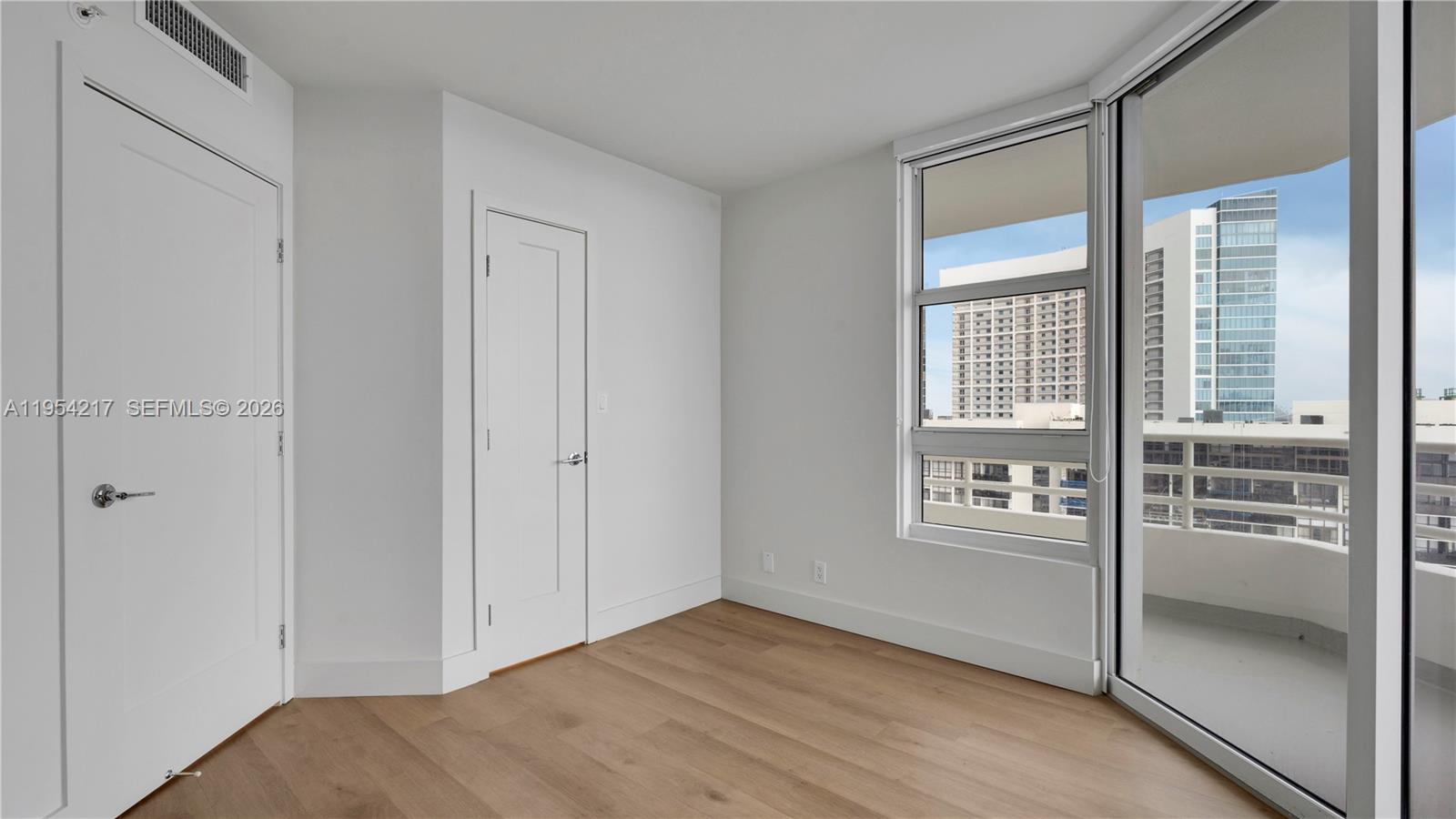 555 Northeast 34th Street, Unit 2201 Miami, FL 33137 - Photo 36 of 46 an empty room with windows