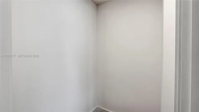 a bathroom with a sink toilet and a mirror