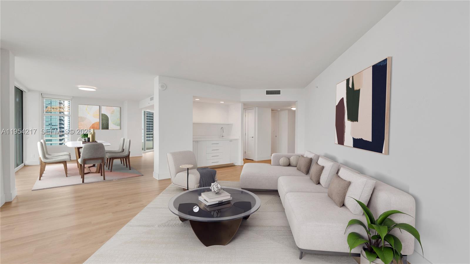 555 Northeast 34th Street, Unit 2201 Miami, FL 33137 - Photo 4 of 46 a living room with furniture and a wooden floor