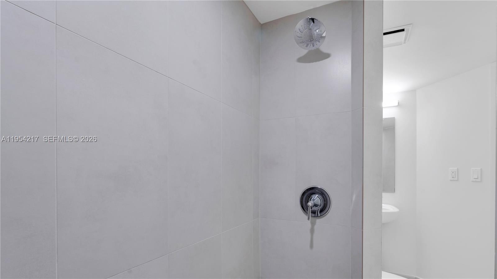555 Northeast 34th Street, Unit 2201 Miami, FL 33137 - Photo 46 of 46 a bathroom with a shower