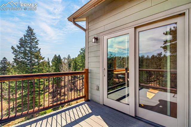 255 Summit Road Manitou Springs, CO 80829 - Photo 26 of 48 Walk out to trex deck from primary bedroom