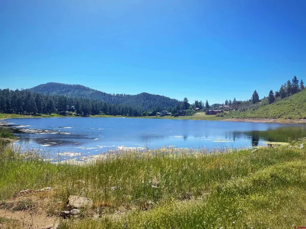 a view of a lake with a mountain in the background