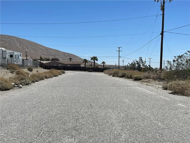 a view of a road with a building in the background