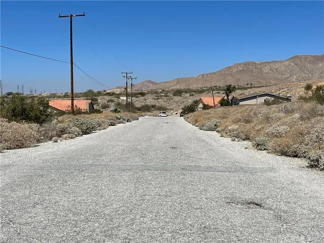 a view of a dry area with a mountain in the background