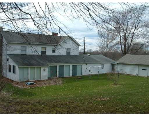 1814 Pulaski Road New Castle, PA 16105 - Photo 2 of 18 Exterior Front. Back of the house with the 41 covered patio and 5 sliding glass doors.