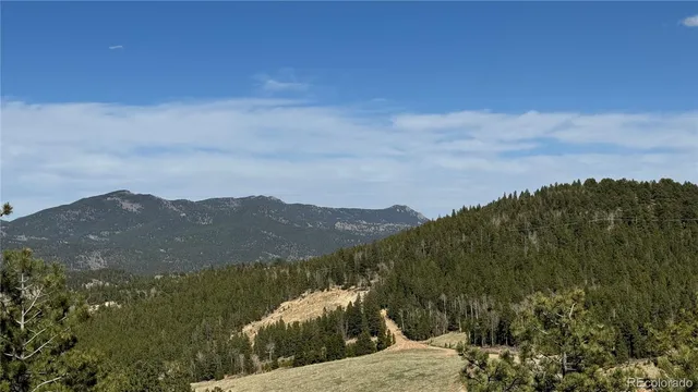 a view of mountain with lake view