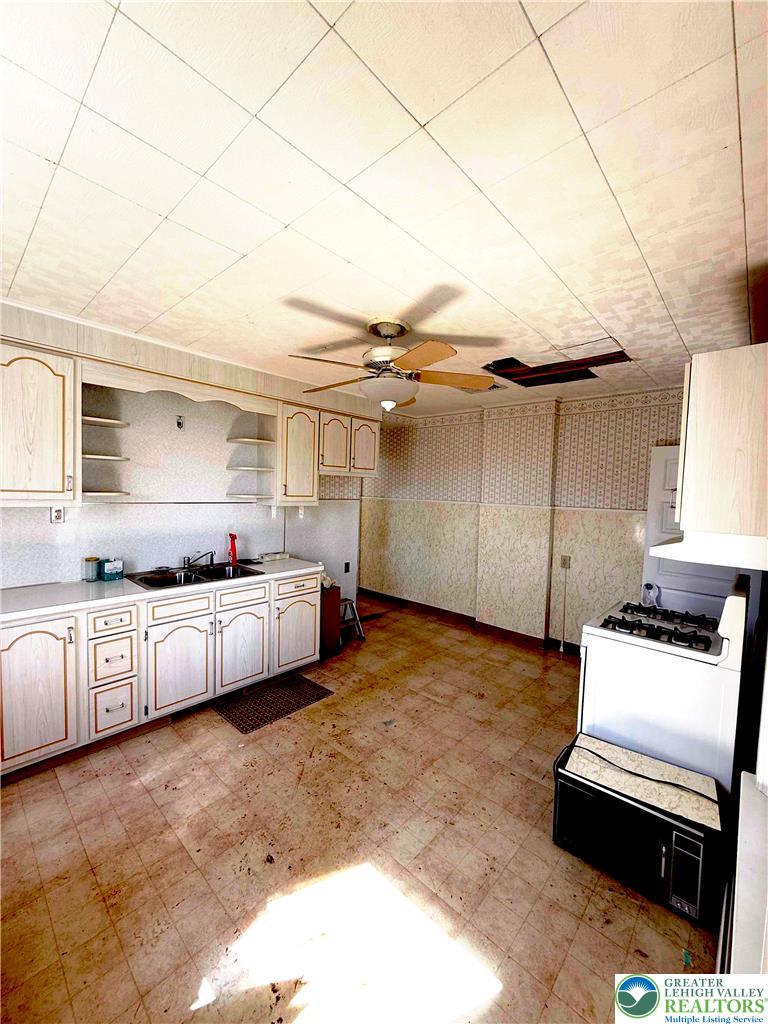 935 Easton Road Hellertown, PA 18055 - Photo 13 of 29 a kitchen with stainless steel appliances kitchen island granite countertop a sink and cabinets