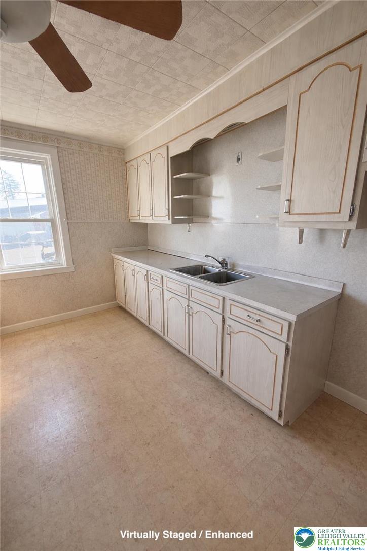 935 Easton Road Hellertown, PA 18055 - Photo 15 of 29 a kitchen with sink cabinets and window