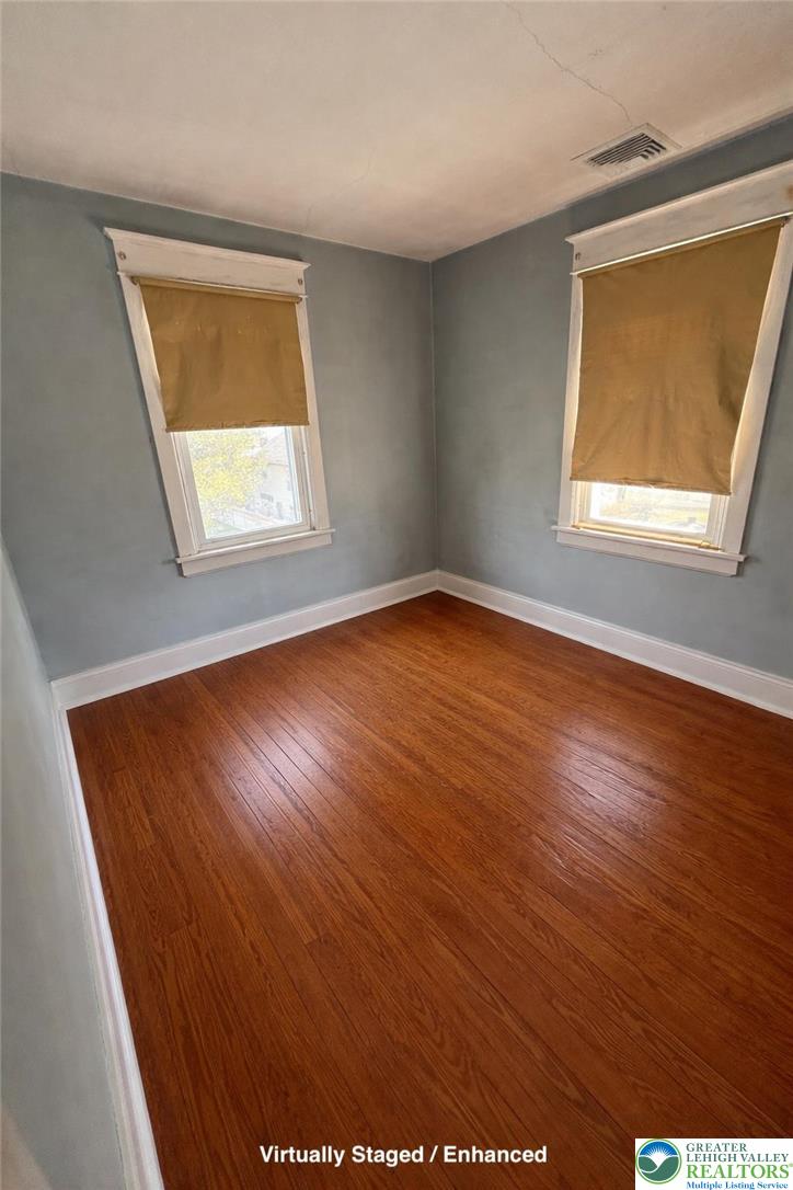 935 Easton Road Hellertown, PA 18055 - Photo 19 of 29 an empty room with wooden floor and windows