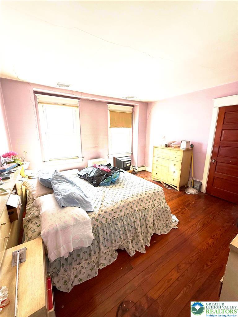 935 Easton Road Hellertown, PA 18055 - Photo 22 of 29 a bedroom with a bed and wooden floor