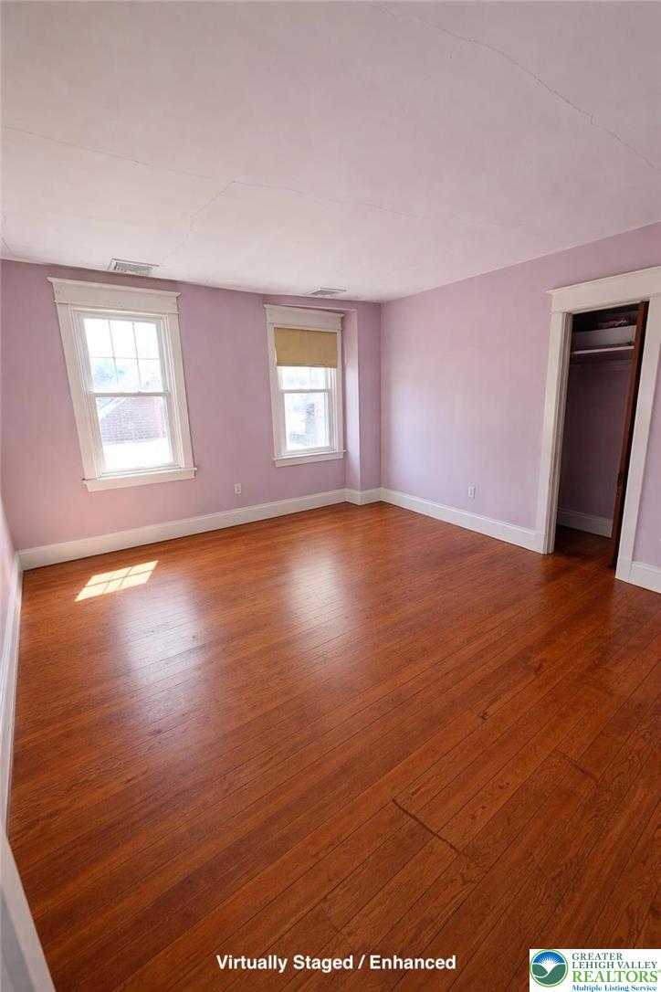 935 Easton Road Hellertown, PA 18055 - Photo 23 of 29 an empty room with wooden floor and windows