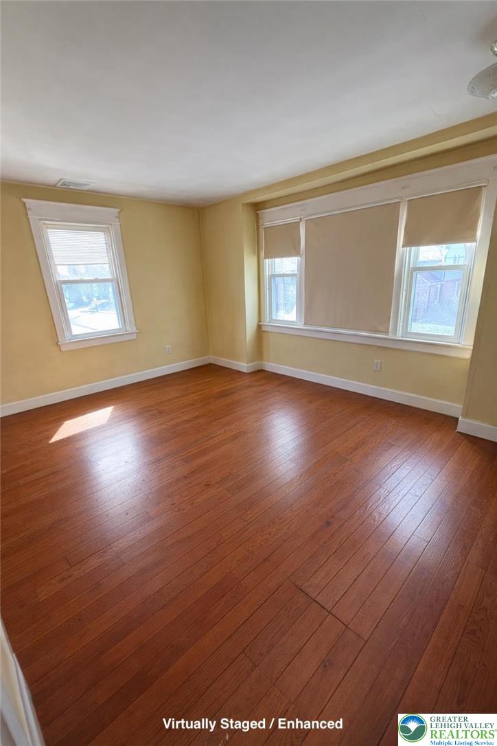935 Easton Road Hellertown, PA 18055 - Photo 26 of 29 a view of an empty room with wooden floor and a window