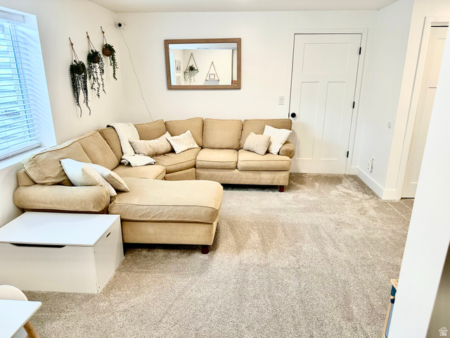 7818 North Windhover Road Eagle Mountain, UT 84005 - Photo 23 of 32 Carpeted floor with baseboards and a three-panel door