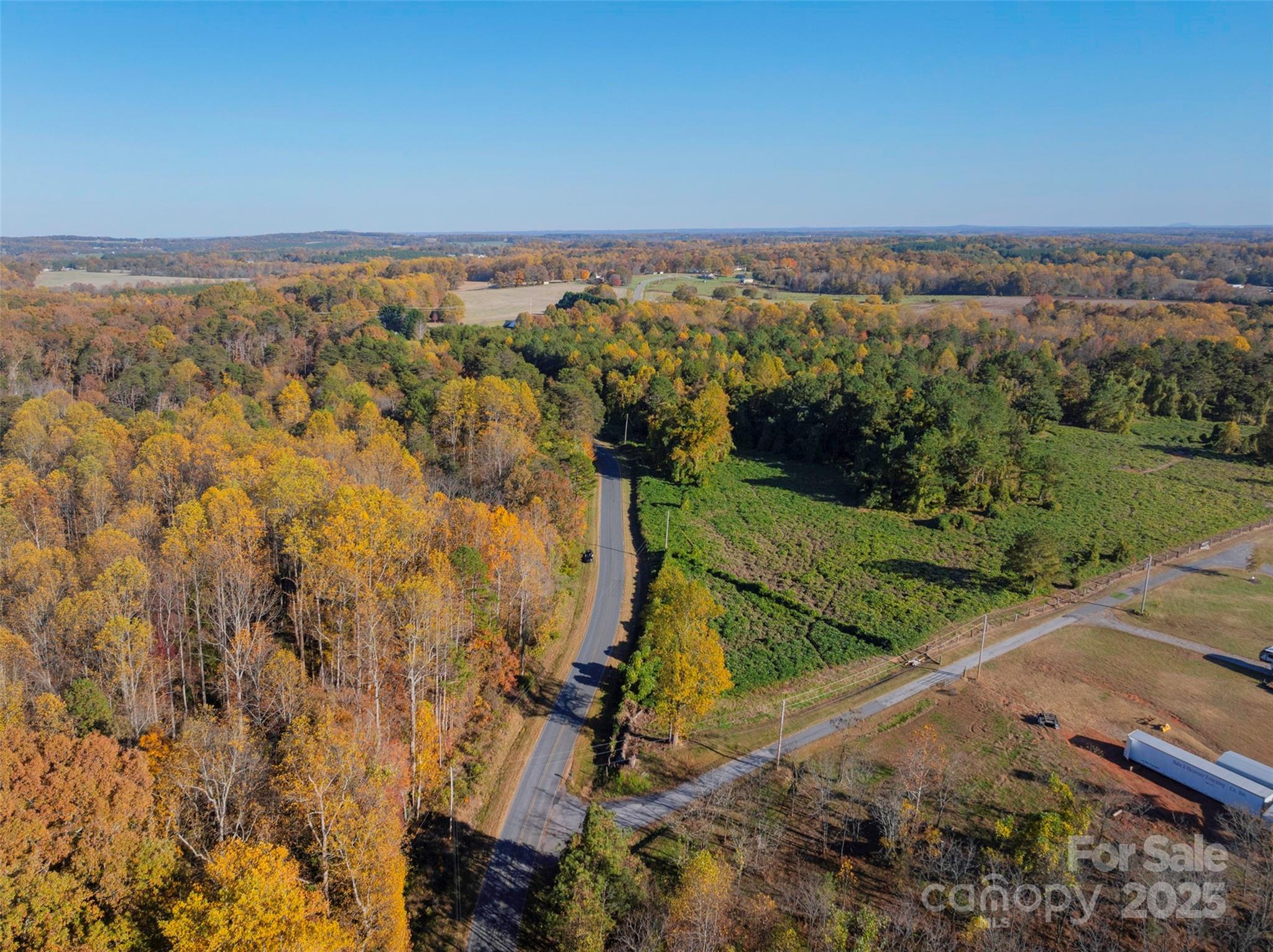 0 Bud Davis Road, Unit 6 Vale, NC 28168 - Photo 26 of 30 an aerial view of a residential houses with outdoor space and trees