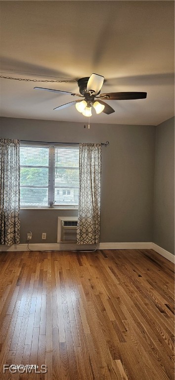 2544 First Street, Unit 202 Fort Myers, FL 33901 - Photo 12 of 20 a view of an empty room with wooden floor and a window