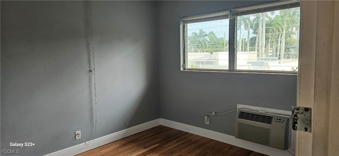 2544 First Street, Unit 202 Fort Myers, FL 33901 - Photo 16 of 20 a view of a room with wooden floor and windows