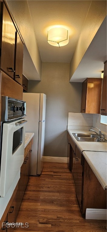 2544 First Street, Unit 202 Fort Myers, FL 33901 - Photo 8 of 20 a kitchen with a stove top oven and refrigerator
