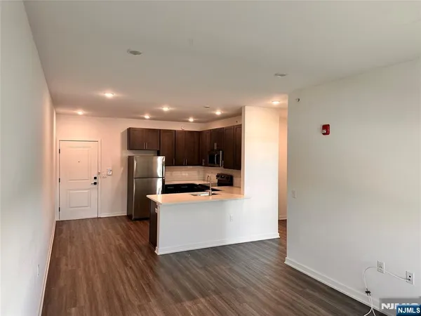 a view of kitchen with wooden floor