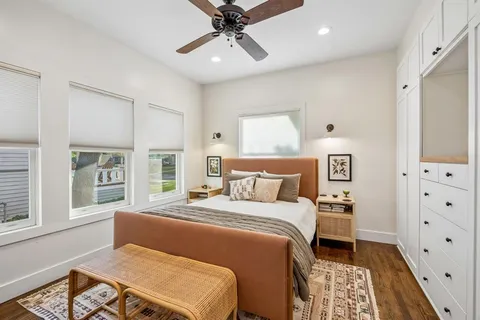 a bedroom with a bed and a dresser