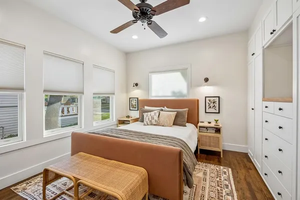 a bedroom with a bed and a dresser