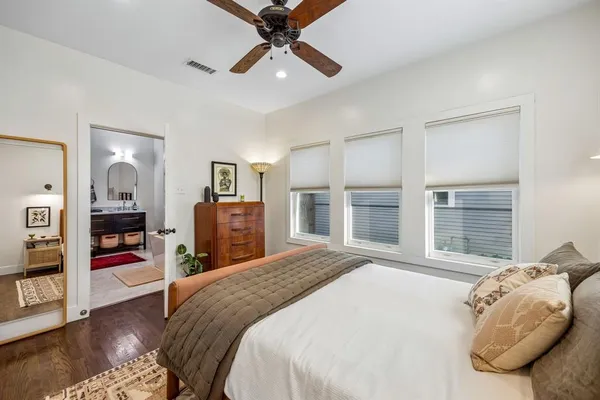 a bed room with a bed and a television