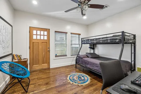 a bedroom with a bed and a table