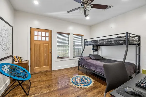 a bedroom with a bed and a table