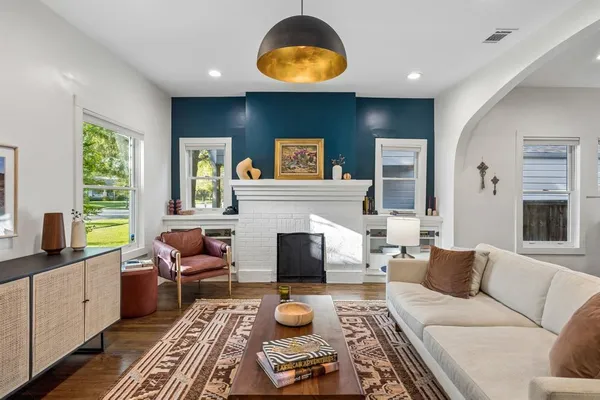 a living room with furniture and a fireplace