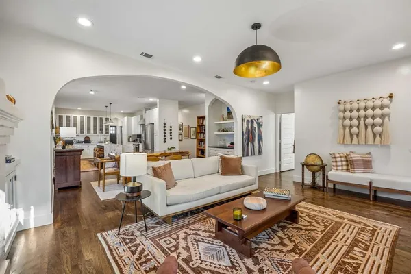 a living room with furniture and a rug