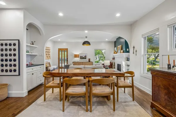 a view of a dining room with furniture and window