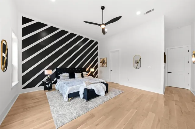 a view of living room with furniture and wooden floor