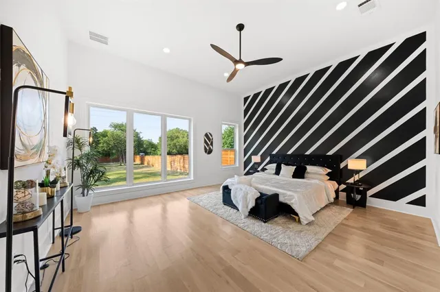 a view of living room with furniture and a floor to ceiling window