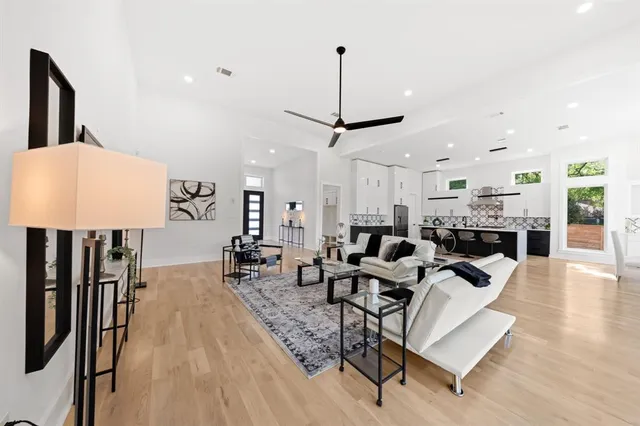 a living room with lots of furniture and a chandelier
