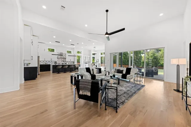 a living room with furniture a table and chairs