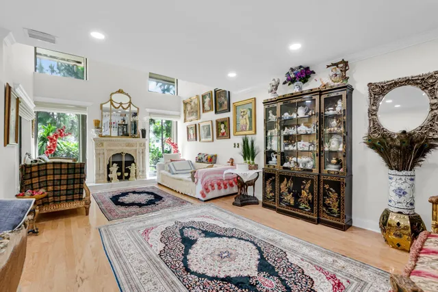 a living room with furniture a rug and a fireplace