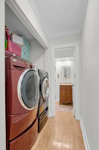 a view of a bedroom with washer and dryer