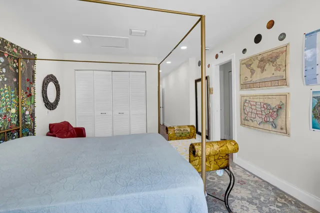 a bedroom with a bed and dresser