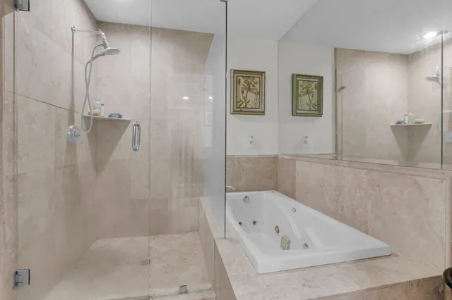 a spacious bathroom with a double vanity sink and a mirror