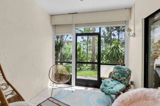 a view of a tree in front of a yard