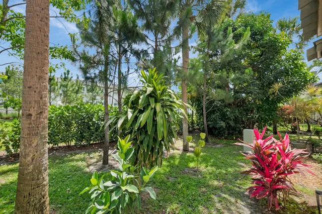 an aerial view of residential houses with outdoor space and swimming pool