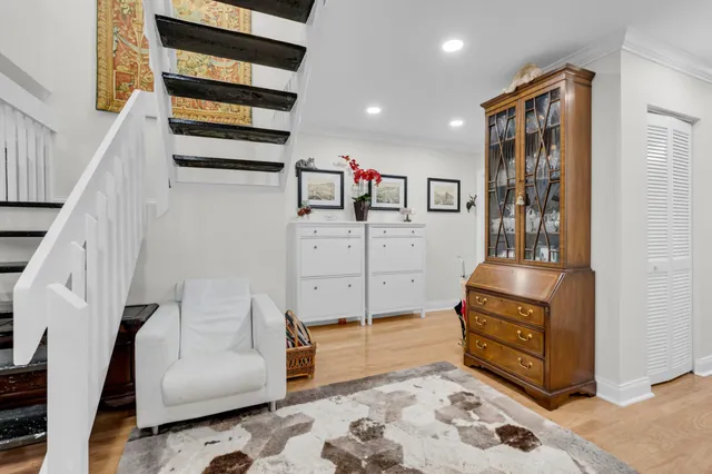 a living room with furniture and a rug