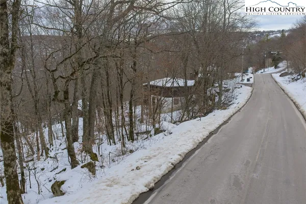 a view of snow on a road