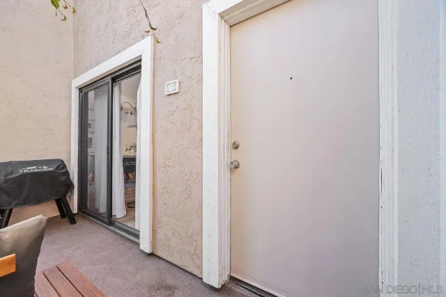 a bedroom with a bed and a mirror