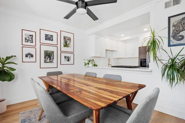 a dining room with furniture and window