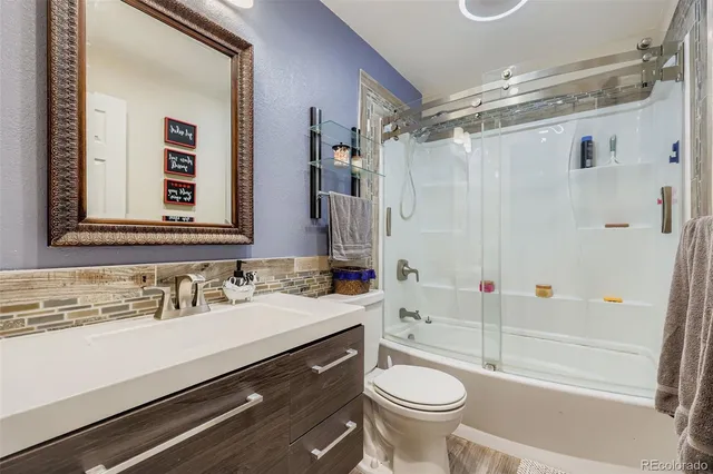 a bathroom with a sink a toilet and a bathtub