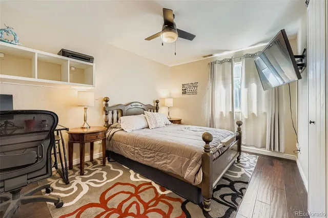 a bedroom with bed and a chandelier