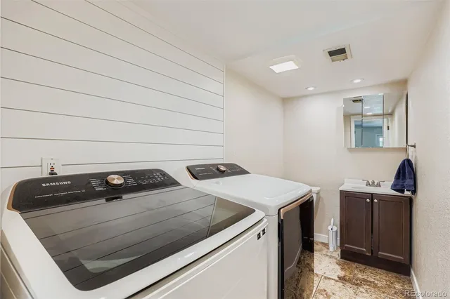 a utility room with dryer and washer